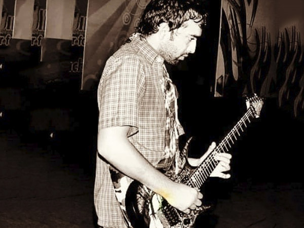 Sri Charan Pakala playing electric guitar